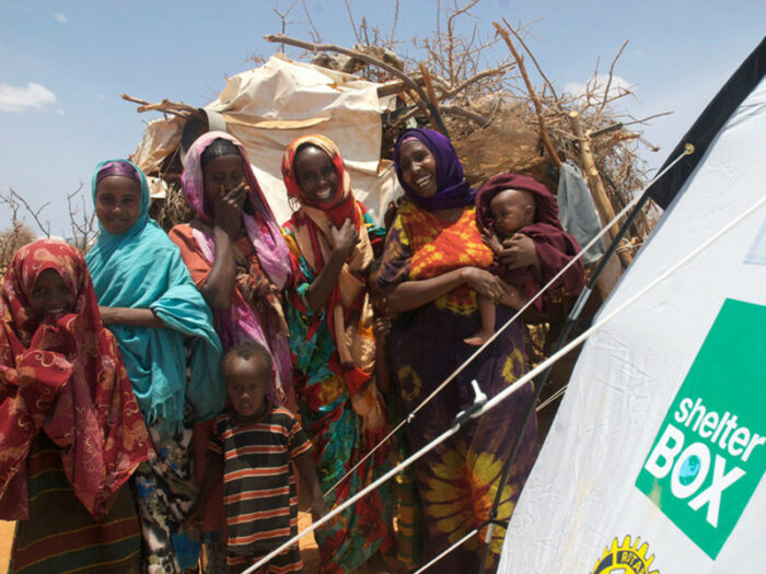 Ethiopian women standing outside a ShelterBox tent