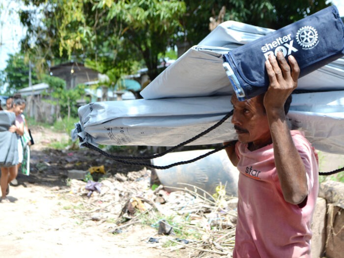 Man carrying aid